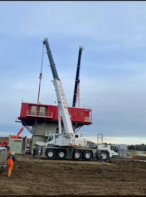 Heavy equipment placement with crane service in Alberta